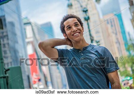 Stock Image - Man posing in city. Fotosearch