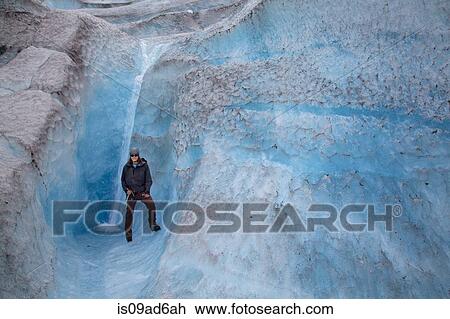 Man standing on Mendenhall Glacier, Alaska, USA View Large Photo Image Stock Image - Man standing on Mendenhall Glacier, Alaska, USA. Fotosearch