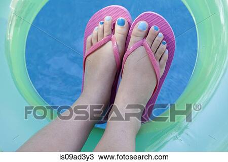 Overhead view of feet with colored nails View Large Photo Image Stock Image - Overhead view of feet with colored nails. Fotosearch