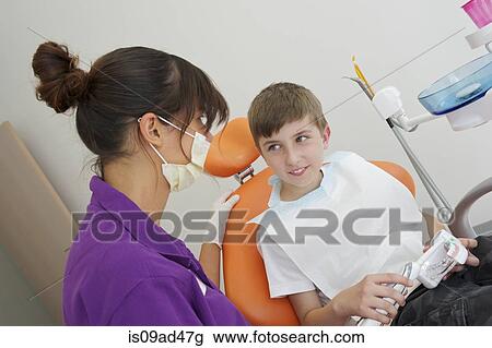 Patient practicing dental brushing on dentures View Large Photo Image Stock Image - Patient practicing dental brushing on dentures. Fotosearch