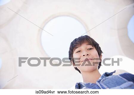 Portrait of boy smiling, low angle View Large Photo Image Stock Photography - Portrait of boy smiling, low angle. Fotosearch