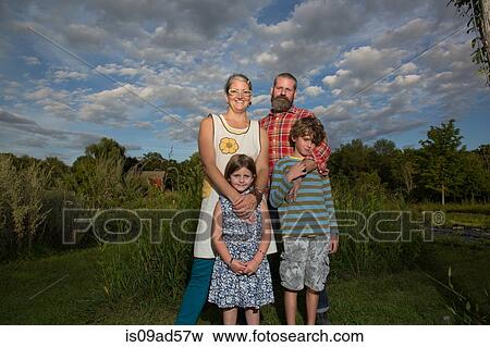 Portrait of couple with children on family herb farm View Large Photo Image Stock Photo - Portrait of couple with children on family herb farm. Fotosearch