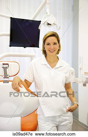 Portrait of female dentist in clinic View Large Photo Image Stock Image - Portrait of female dentist in clinic. Fotosearch