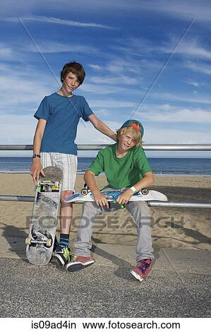 Picture - Portrait of two skateboarding friends. Fotosearch