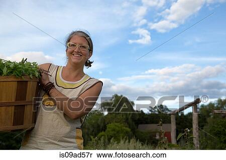 Portrait of woman working on herb farm View Large Photo Image Stock Photography - Portrait of woman working on herb farm. Fotosearch