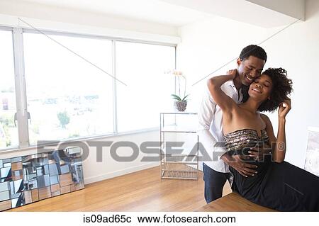 Portrait of young couple hugging View Large Photo Image Stock Image - Portrait of young couple hugging. Fotosearch