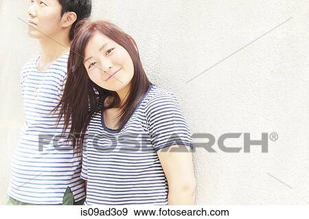 Portrait of young couple wearing striped top garments View Large Photo Image Stock Photo - Portrait of young couple wearing striped top garments. Fotosearch