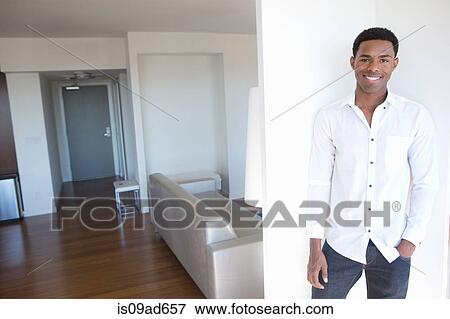Portrait of young man wearing white shirt View Large Photo Image Stock Photo - Portrait of young man wearing white shirt. Fotosearch