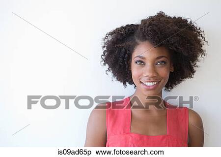 Portrait of young woman against white background View Large Photo Image Stock Photography - Portrait of young woman against white background. Fotosearch