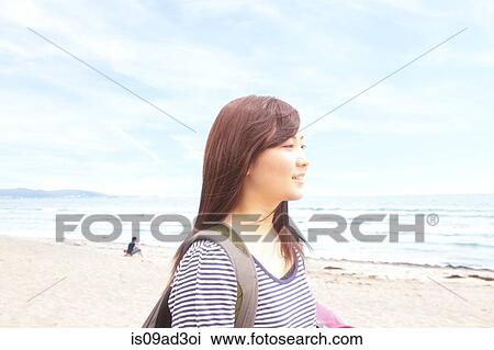 Portrait of young woman at beach View Large Photo Image Stock Image - Portrait of young woman at beach. Fotosearch