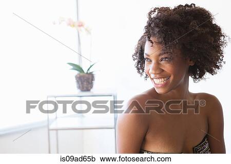 Portrait of young woman looking away View Large Photo Image Stock Image - Portrait of young woman looking away. Fotosearch
