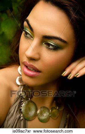 Stock Photography - Portrait of young woman, wearing swimsuit and necklace. Fotosearch