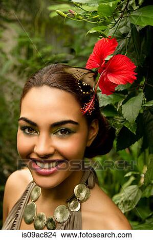 Portrait of young woman with red orchid and foliage View Large Photo Image Picture - Portrait of young woman with red orchid and foliage. Fotosearch