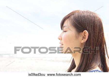 Profile of young woman with eyes closed View Large Photo Image Stock Photograph - Profile of young woman with eyes closed. Fotosearch