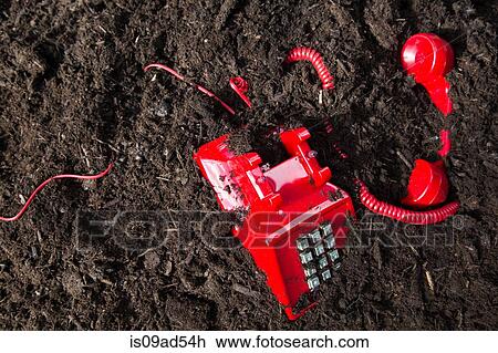 Red retro telephone buried in soil View Large Photo Image Stock Image - Red retro telephone buried in soil. Fotosearch