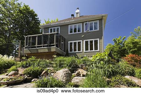 Residential house with conservatory, Quebec, Canada View Large Photo Image Stock Image - Residential house with conservatory, Quebec, Canada. Fotosearch