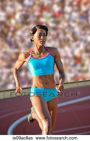 Runner racing on track View Large Photo Image Stock Photograph - Runner racing on track. Fotosearch