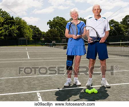 Senior couple on tennis court View Large Photo Image Picture - Senior couple on tennis court. Fotosearch