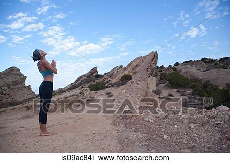 Side view of woman doing yoga at Vazquez Rocks, LA View Large Photo Image Stock Image - Side view of woman doing yoga at Vazquez Rocks, LA. Fotosearch