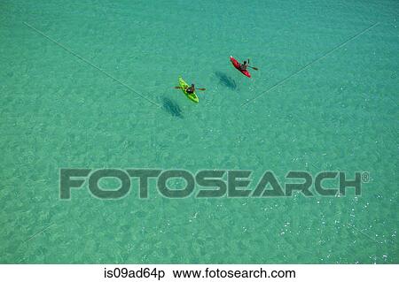 Stock Photography - Two people canoeing in Gulf of Mexico, Destin, Florida, USA. Fotosearch