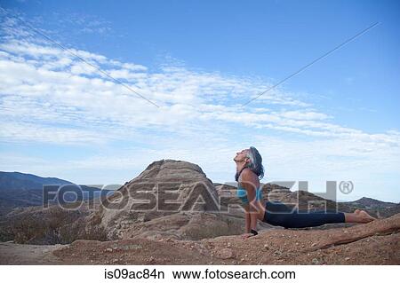 Woman doing yoga at Vazquez Rocks View Large Photo Image Picture - Woman doing yoga at Vazquez Rocks. Fotosearch