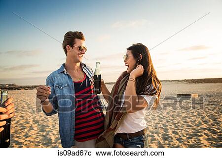 Young couple on Mission Beach, woman holding cola, San Diego, California, USA View Large Photo Image Stock Image - Young couple on Mission Beach, woman holding cola, San Diego, California, USA. Fotosearch