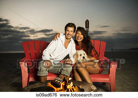 Young couple sitting by campfire on Mission Beach, San Diego, California, USA View Large Photo Image Stock Photograph - Young couple sitting by campfire on Mission Beach, San Diego, California, USA. Fotosearch