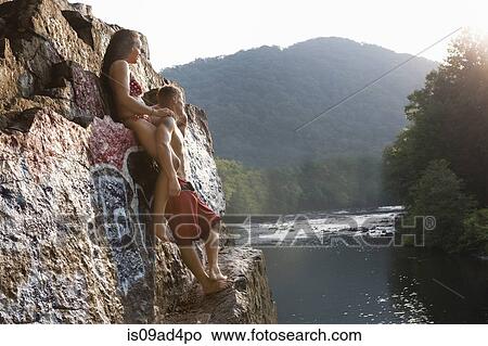 Young couple standing on rock ledge, Hamburg, Pennsylvania, USA View Large Photo Image Picture - Young couple standing on rock ledge, Hamburg, Pennsylvania, USA. Fotosearch