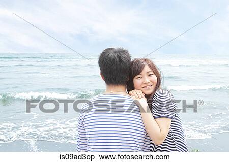 Stock Photography - Young woman leaning on boyfriend's shoulder. Fotosearch