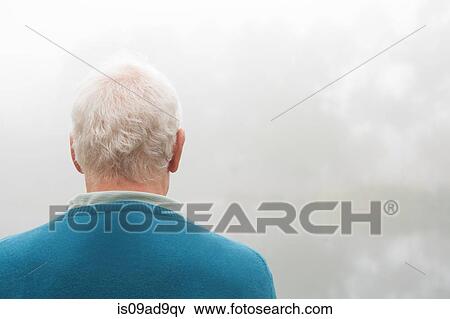 Back view of senior man in blue top View Large Photo Image Stock Photo - Back view of senior man in blue top. Fotosearch