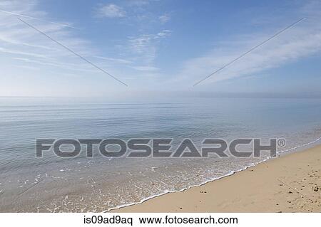 Calm sea and blue sky, Poole, Dorset, UK View Large Photo Image Stock Photography - Calm sea and blue sky, Poole, Dorset, UK. Fotosearch