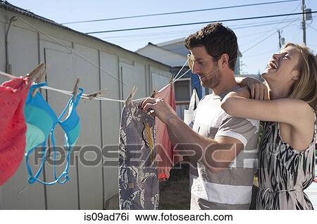Couple hanging out swimwear, Breezy Point, Queens, New York, USA View Large Photo Image Stock Image - Couple hanging out swimwear, Breezy Point, Queens, New York, USA. Fotosearch