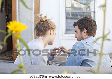 Couple looking at digital tablet, Breezy Point, Queens, New York, USA View Large Photo Image Picture - Couple looking at digital tablet, Breezy Point, Queens, New York, USA. Fotosearch