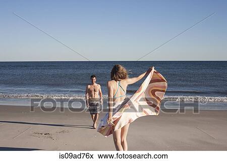 Couple on beach, Breezy Point, Queens, New York, USA View Large Photo Image Stock Photo - Couple on beach, Breezy Point, Queens, New York, USA. Fotosearch