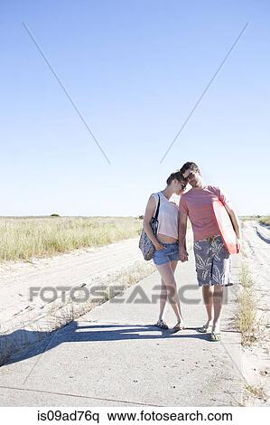 Couple on coastal path, Breezy Point, Queens, New York, USA View Large Photo Image Stock Photography - Couple on coastal path, Breezy Point, Queens, New York, USA. Fotosearch