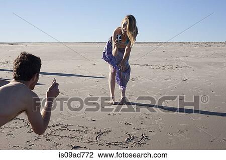 Couple writing in sand, Breezy Point, Queens, New York, USA View Large Photo Image Stock Image - Couple writing in sand, Breezy Point, Queens, New York, USA. Fotosearch