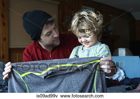 Father and toddler daughter at home in sitting room View Large Photo Image Stock Photo - Father and toddler daughter at home in sitting room. Fotosearch