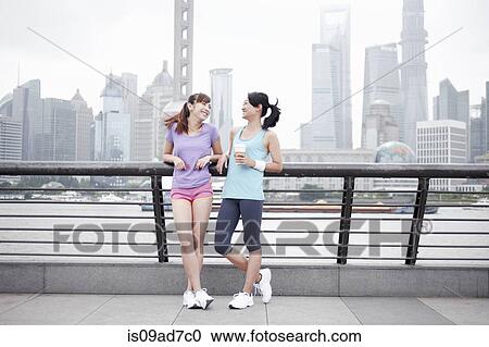Female friends on bridge in Shanghai, China View Large Photo Image Stock Image - Female friends on bridge in Shanghai, China. Fotosearch