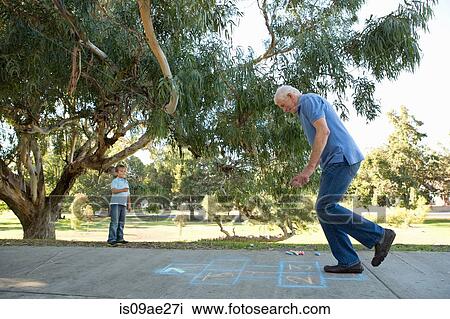 Grandfather on hopscotch, boy watching View Large Photo Image Stock Image - Grandfather on hopscotch, boy watching. Fotosearch