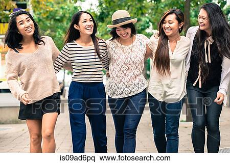 Stock Photography - Group of five young women with arms around, smiling. Fotosearch