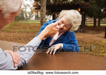 Husband and wife arm wrestling playfully View Large Photo Image Stock Photo - Husband and wife arm wrestling playfully. Fotosearch