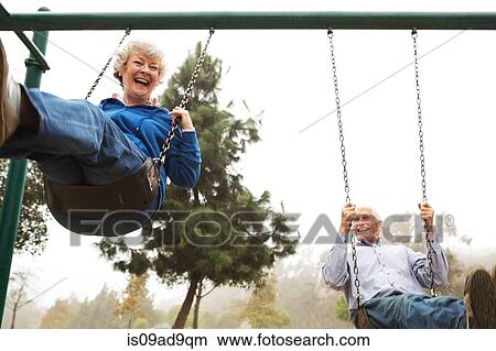 Husband and wife on swing View Large Photo Image Picture - Husband and wife on swing. Fotosearch