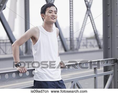 Jogger on a bridge View Large Photo Image Picture - Jogger on a bridge. Fotosearch