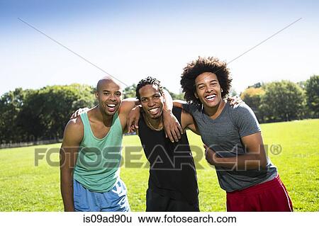Portrait of three young men smiling View Large Photo Image Stock Photograph - Portrait of three young men smiling. Fotosearch