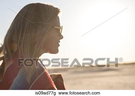 Portrait of young woman wrapped in blanket, Breezy Point, Queens, New York, USA View Large Photo Image Stock Image - Portrait of young woman wrapped in blanket, Breezy Point, Queens, New York, USA. Fotosearch