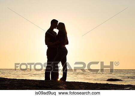 Silhouette of young couple kissing, Sunset Cliffs, San Diego, California, USA View Large Photo Image Stock Photography - Silhouette of young couple kissing, Sunset Cliffs, San Diego, California, USA. Fotosearch