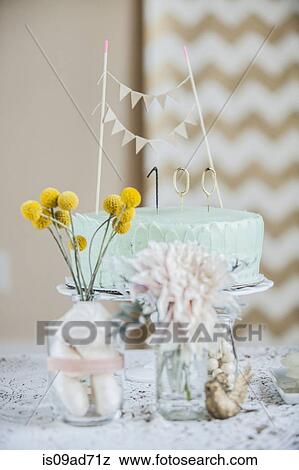 Stock Photo - Still life of celebration cake with flowers and decoration. Fotosearch