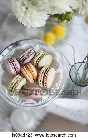 Stock Image - Still life of macaroons with flowers and decoration. Fotosearch