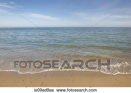 Stock Photo - View of sea and beach, Poole, Dorset, UK. Fotosearch
