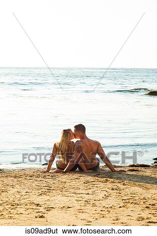 Young couple kissing on beach, Sunset Cliffs, San Diego, California, USA View Large Photo Image Stock Photograph - Young couple kissing on beach, Sunset Cliffs, San Diego, California, USA. Fotosearch